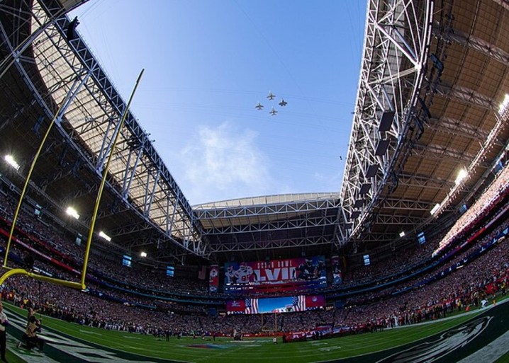 Jets fly over the Super Bowl.