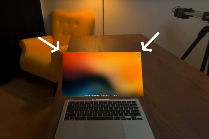 This MacBook has nary bezels, acknowledgment to Luke Miani's surface removal and Vision Pro replacement.