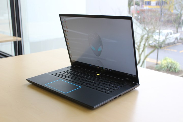 The Alienware m16 R2 on a table in front of a window.
