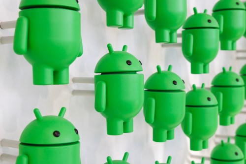 A photo of many Android figurines on a white wall.