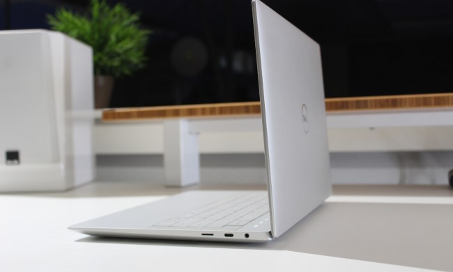 The side of the open Dell XPS 14 on a white table.
