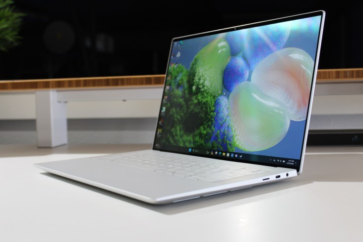 The Dell XPS 14 on a white table with the screen open.