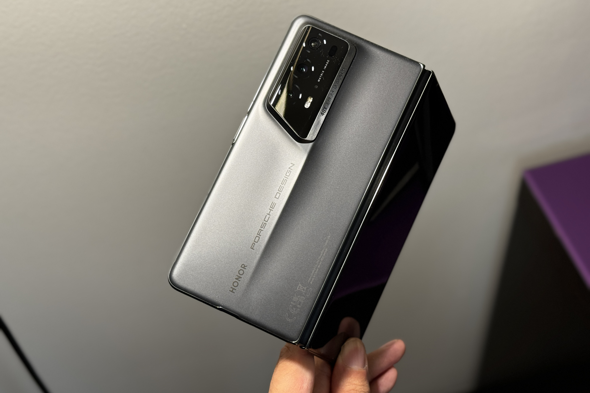 Someone holding the Honor Magic V2 RSR, showing the back of the phone.