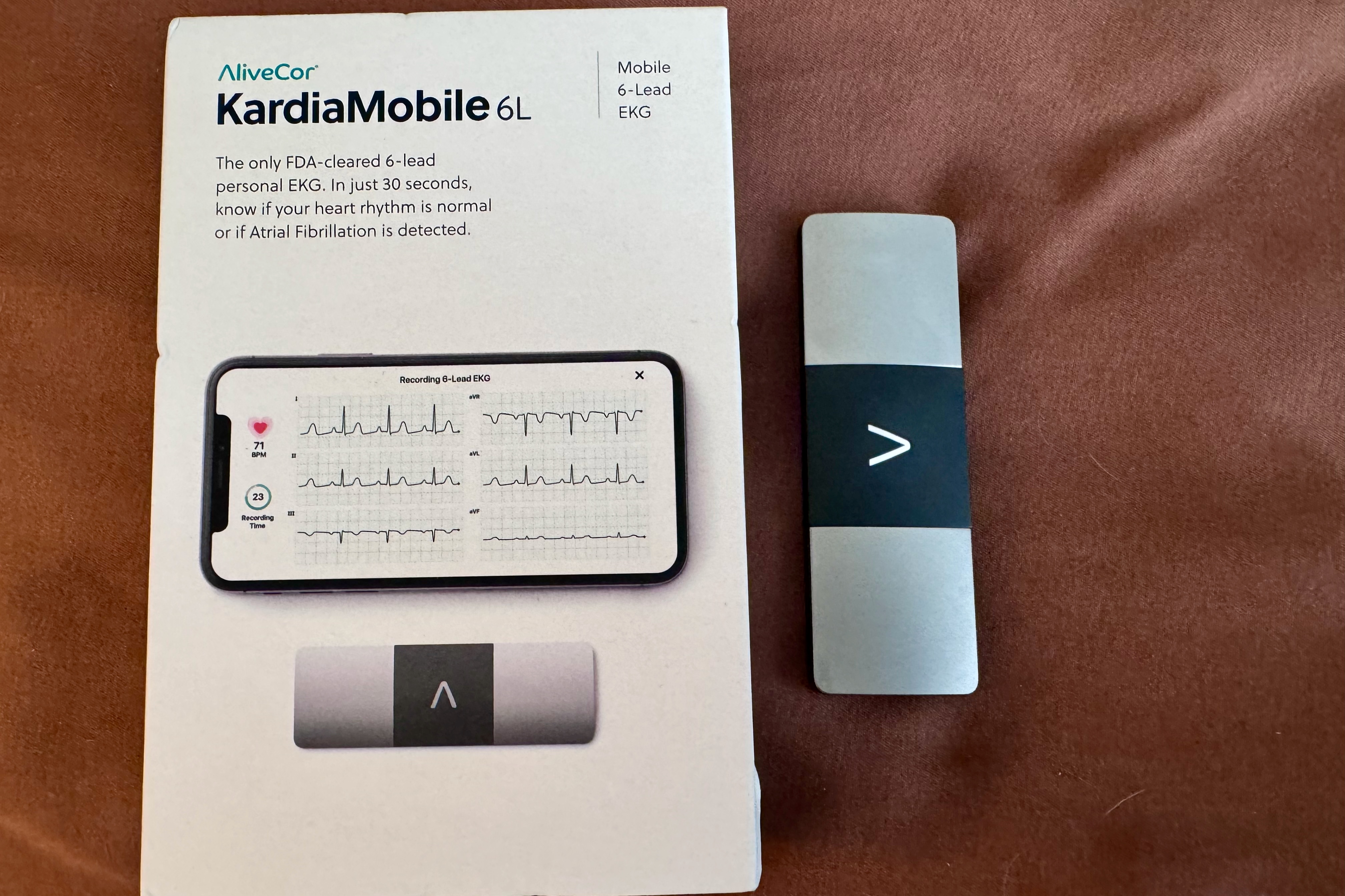 A KardioMobile 6L device next to its box.