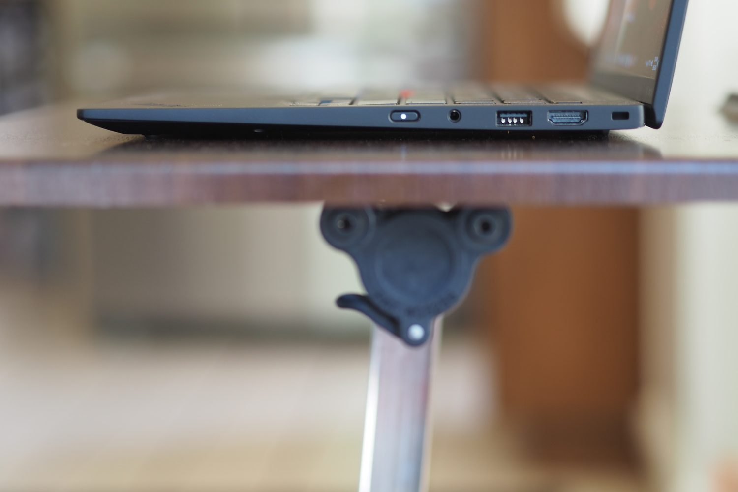 Lenovo ThinkPad X1 Carbon Gen 12 side view showing ports and lid.