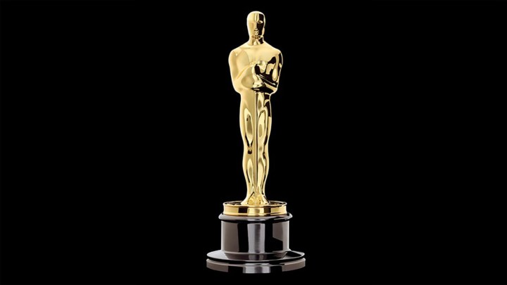 The Oscar statue on a black background.