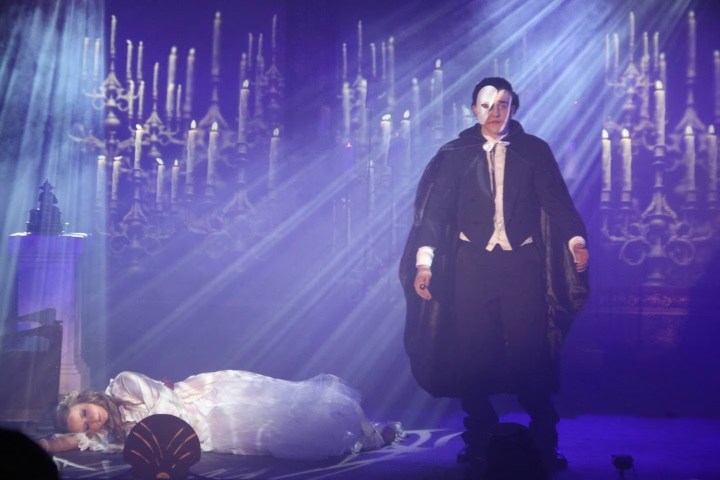 The Phantom stands over Christine in The Phantom of the Opera.