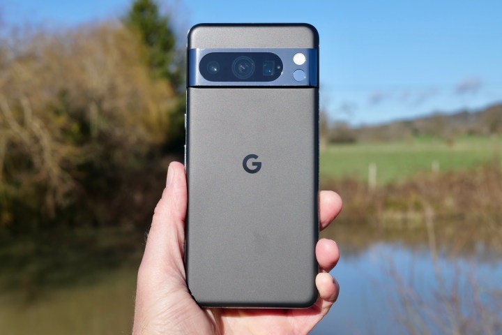 A person holding the Google Pixel 8 Pro.