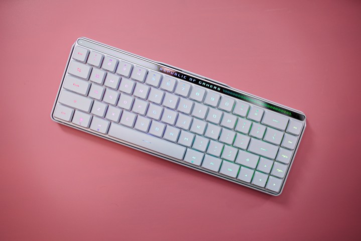 The Asus ROG Falchion RX LP keyboard connected a pinkish background.