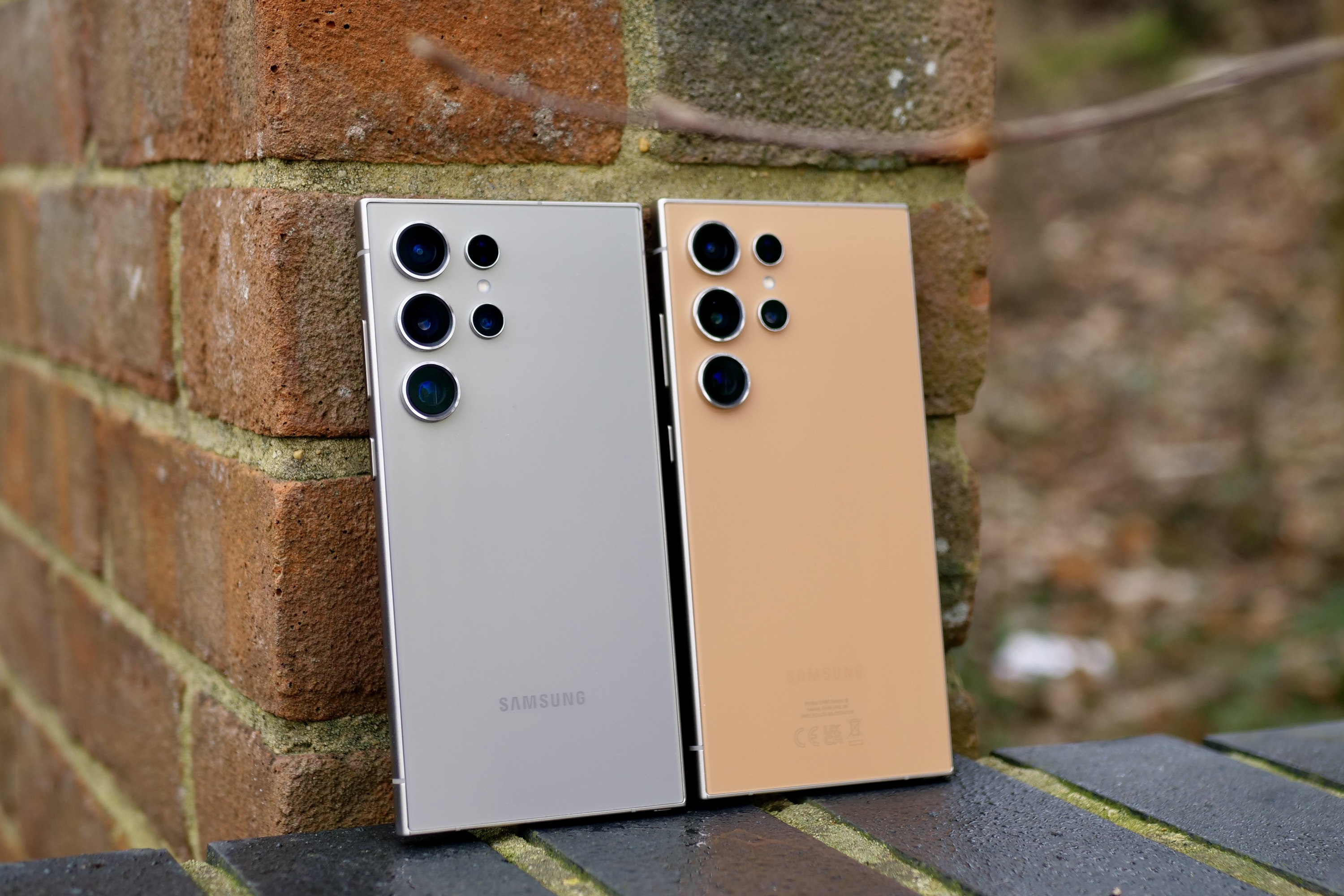 The Samsung Galaxy S24 Ultra in Titanium Orange and in Titanium Silver.
