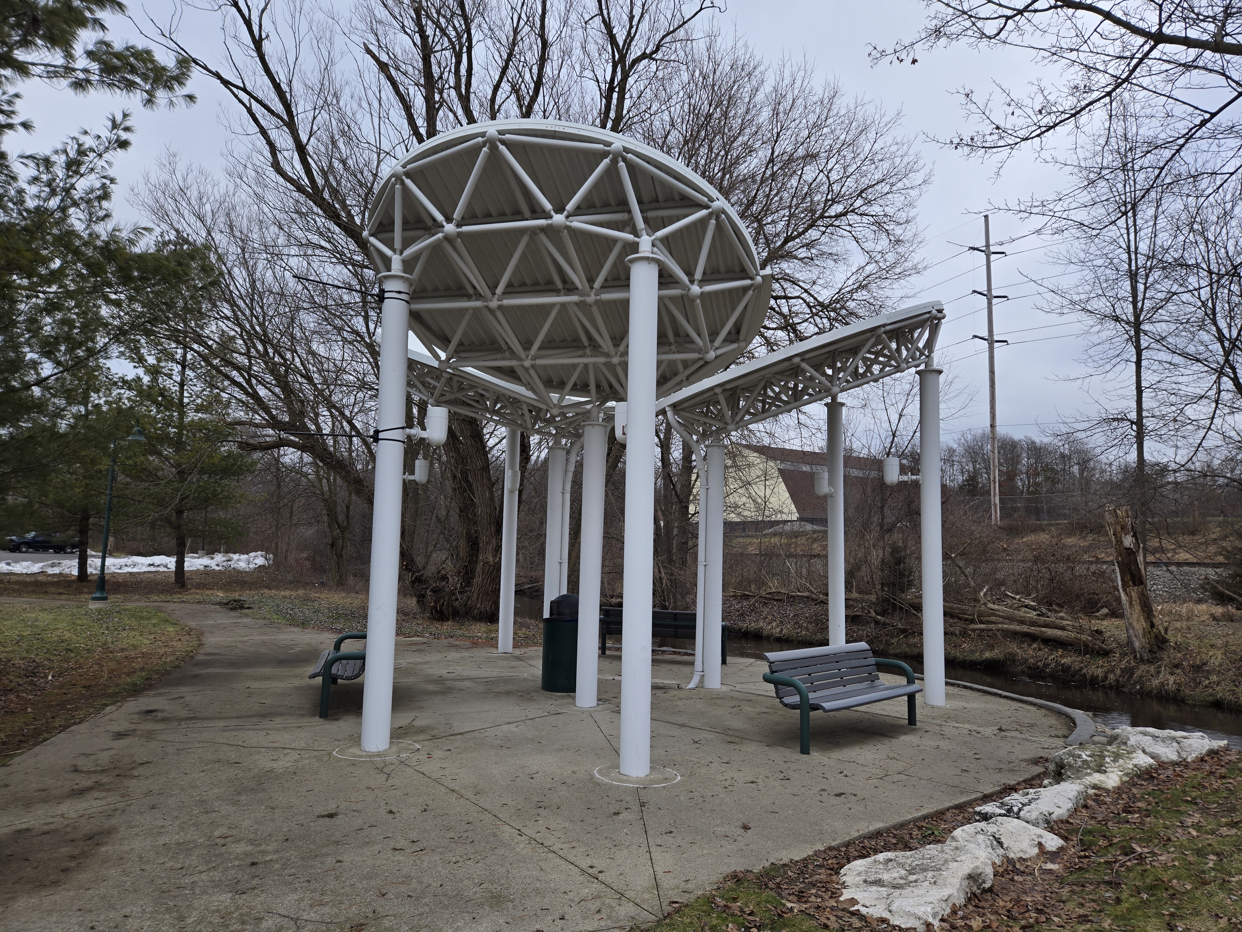 A photo of a structure in a small park.