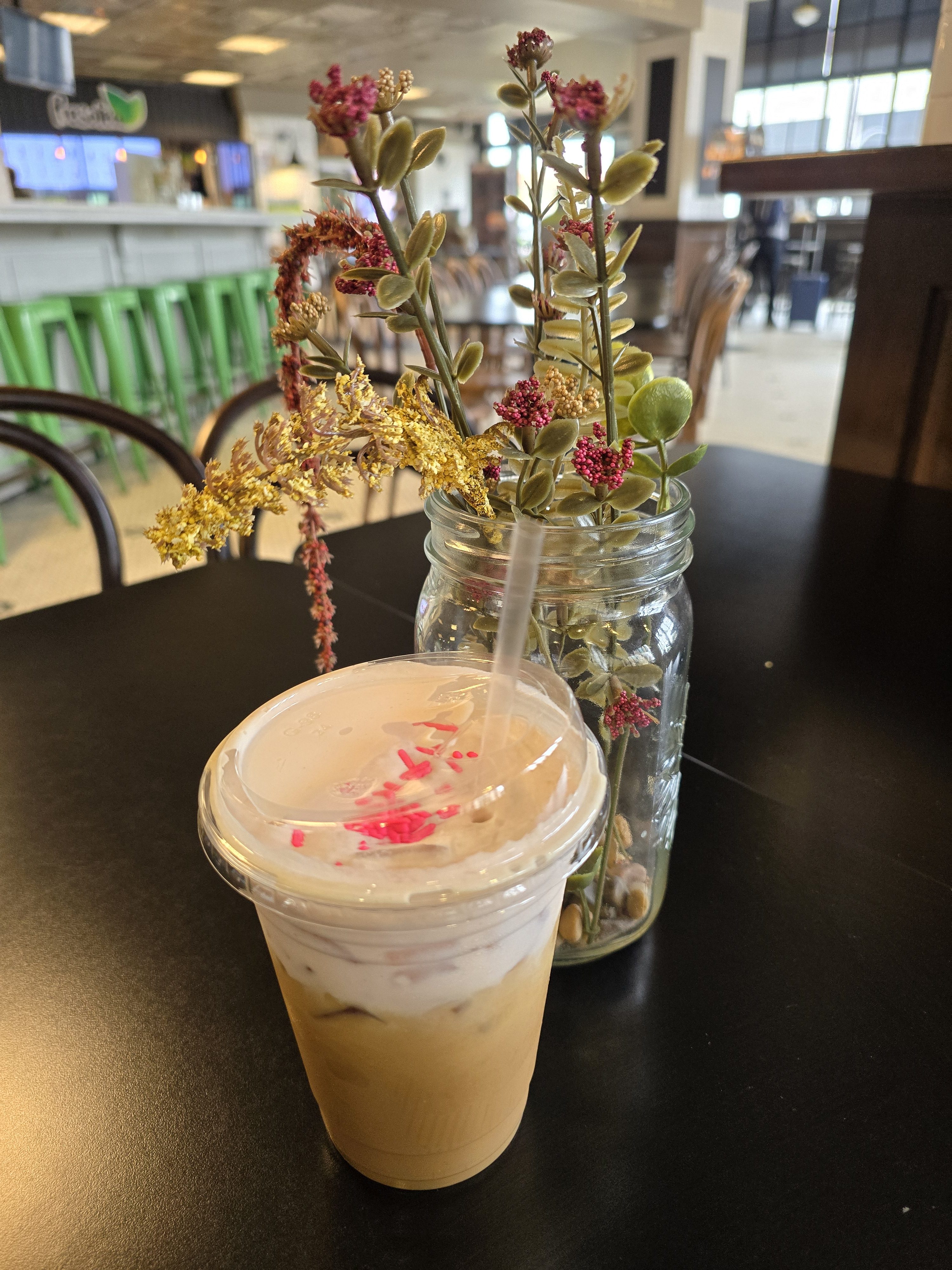 Photo of a cold brew drink and a plant decor on a table taken with the S24 Ultra.