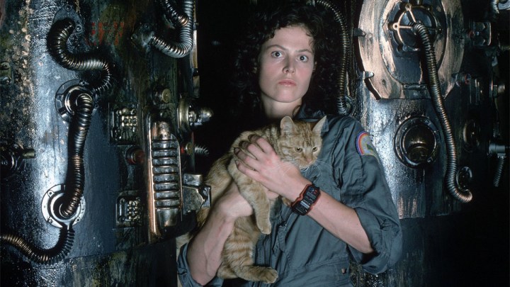 Ripley holds a cat in Alien.