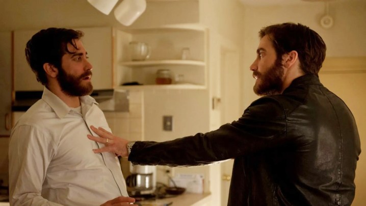 Jake Gyllenhaal pushes an identical Jake Gyllenhaal in a still from the movie Enemy