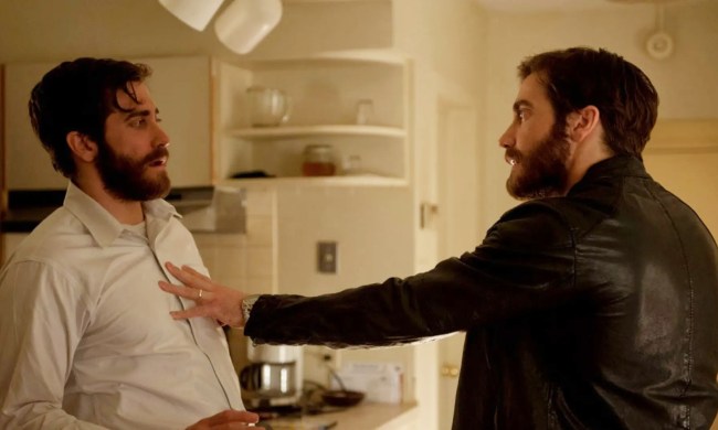 Jake Gyllenhaal pushes an identical Jake Gyllenhaal in a still from the movie Enemy