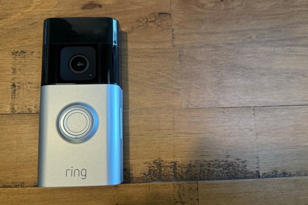 The Ring Battery Doorbell Pro on a wooden background.