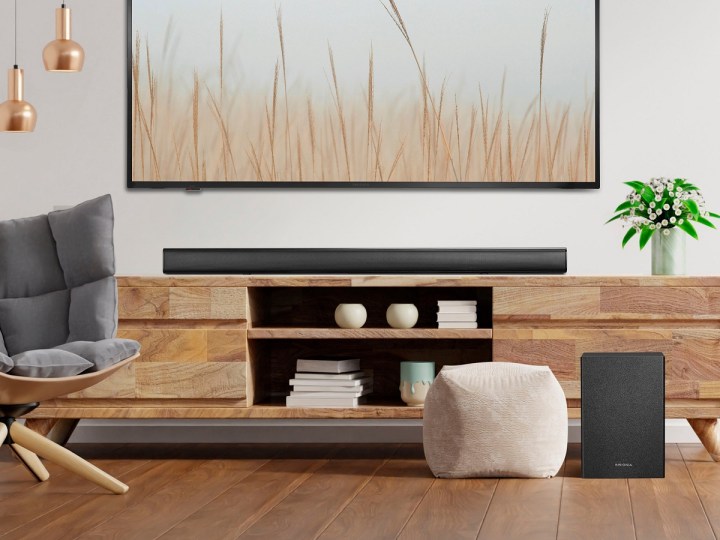 The Insignia 2.1-channel soundbar with wireless subwoofer in a living room.