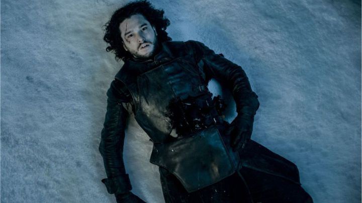 Kit Harington as Jon Snow lying on the ground wounded in Game of Thrones.