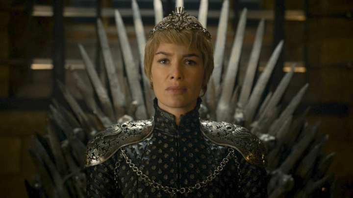Lena Headey as Cersei Lannister sitting on the Iron Throne in Game of Thrones.