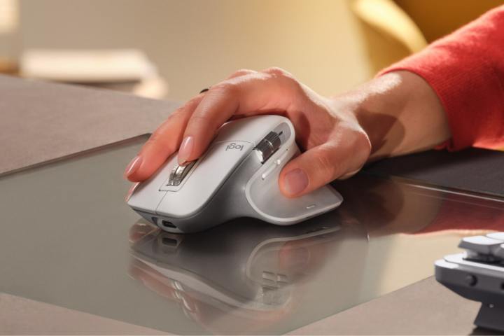 A person using the Logitech MX Master 3S for Mac mouse on a desk.