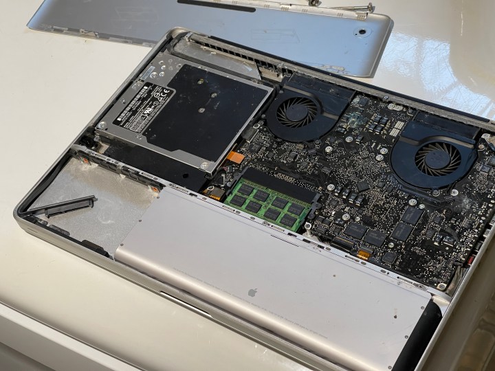 A photo of the back of a MacBook Pro open up