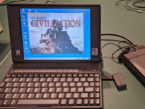 The HP OmniBook 800CT on a table with Civilization loaded up on it. 