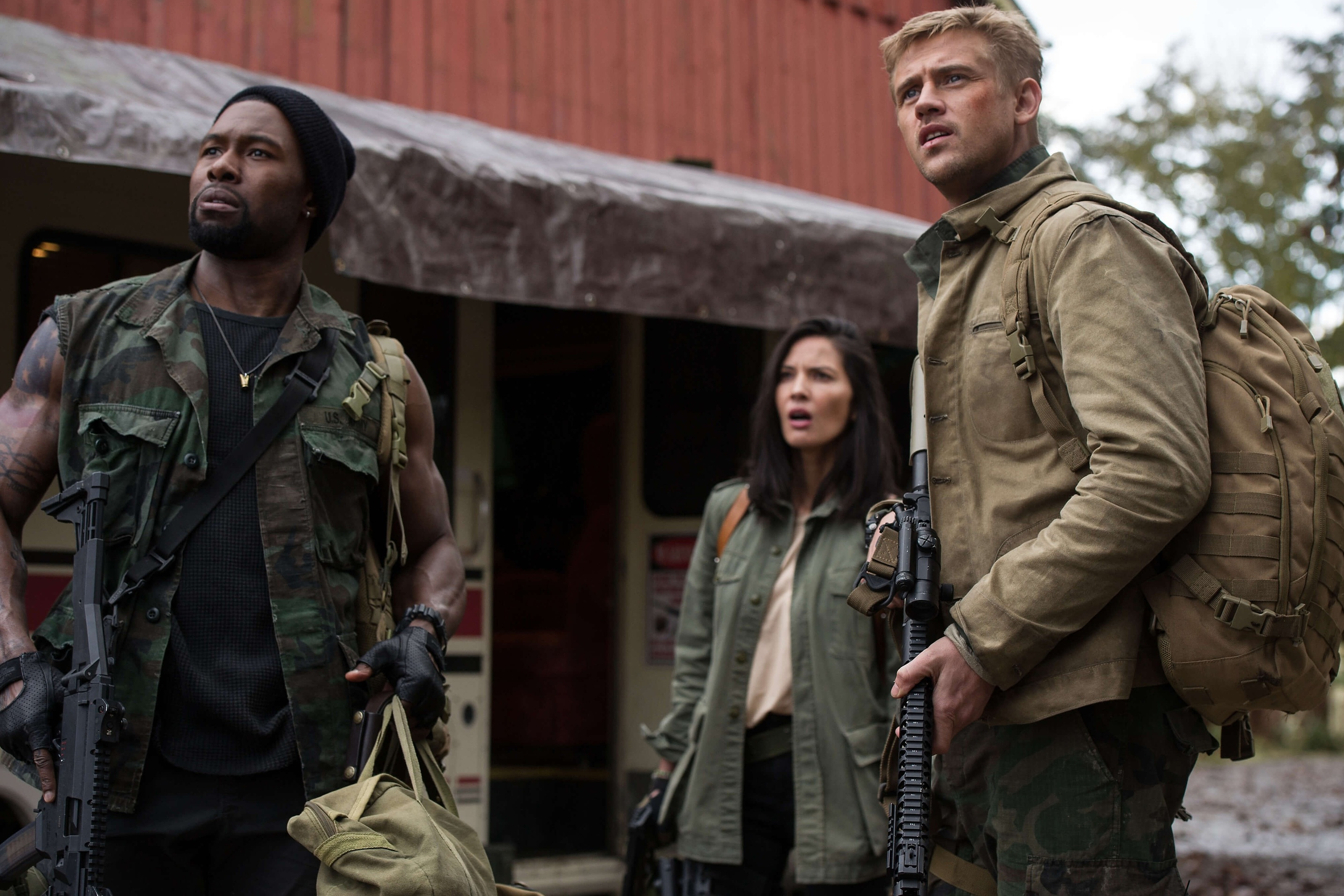Trevante Rhodes, Olivia Munn, and Boyd Holbrook stand together in The Predator.