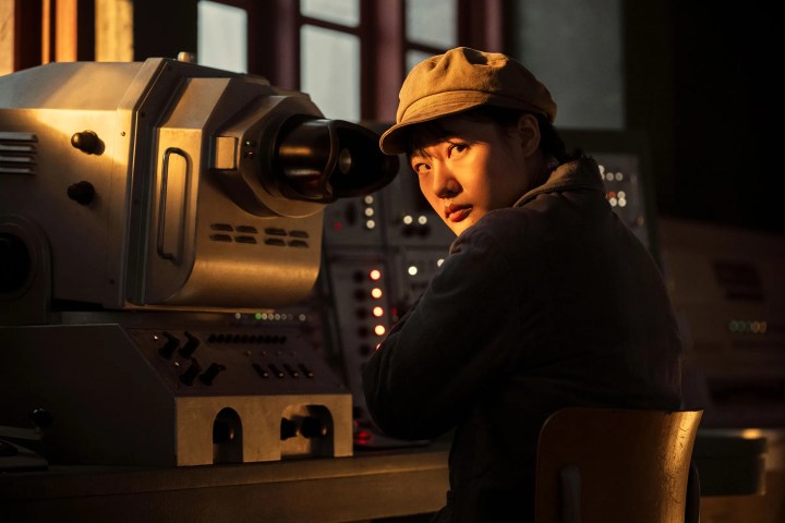 Ye Wenjie sits in front of a radio dish controller in 3 Body Problem.
