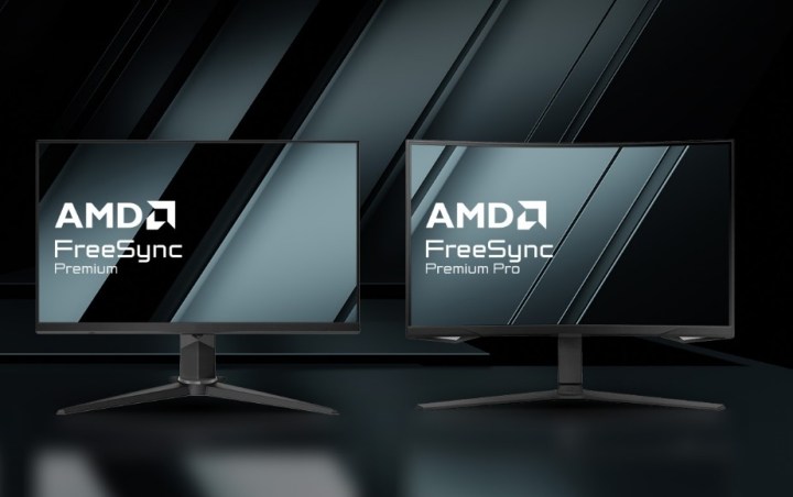 Two monitors with AMD FreeSync over a dark background.