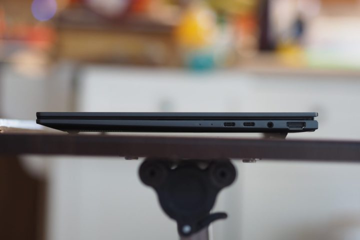 Asus Zenbook 14 Q425 right side view showing ports and vents.