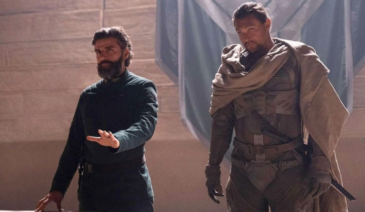 Two men stand next to each other in Dune.
