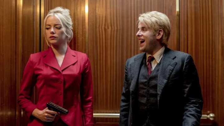 A man and a woman stand in an elevator in Maniac.