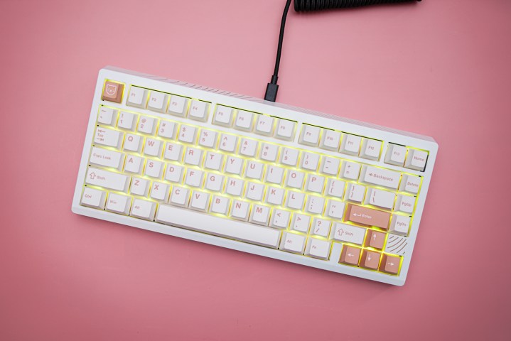 The Meletrix Boog75 keyboard on a pink background.