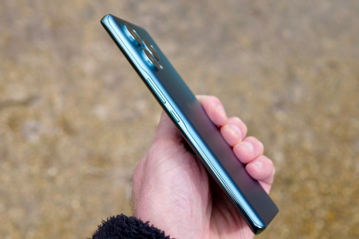 A person holding the Nuu B30 Pro, showing the side of the phone.
