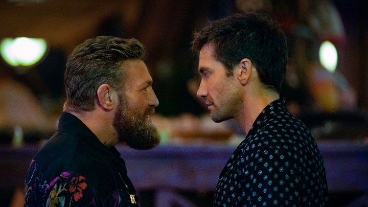 Conor McGregor and Jake Gyllenhaal standing face to face in a scene from Road House on Amazon Prime Video.