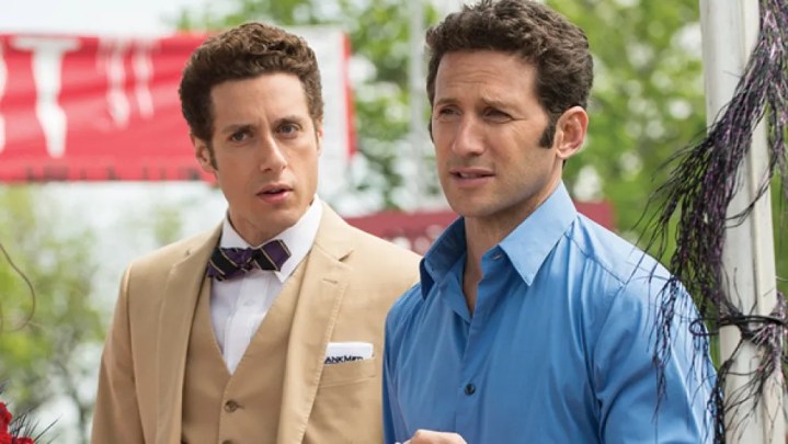 Two men stand next to each other in Royal Pains.