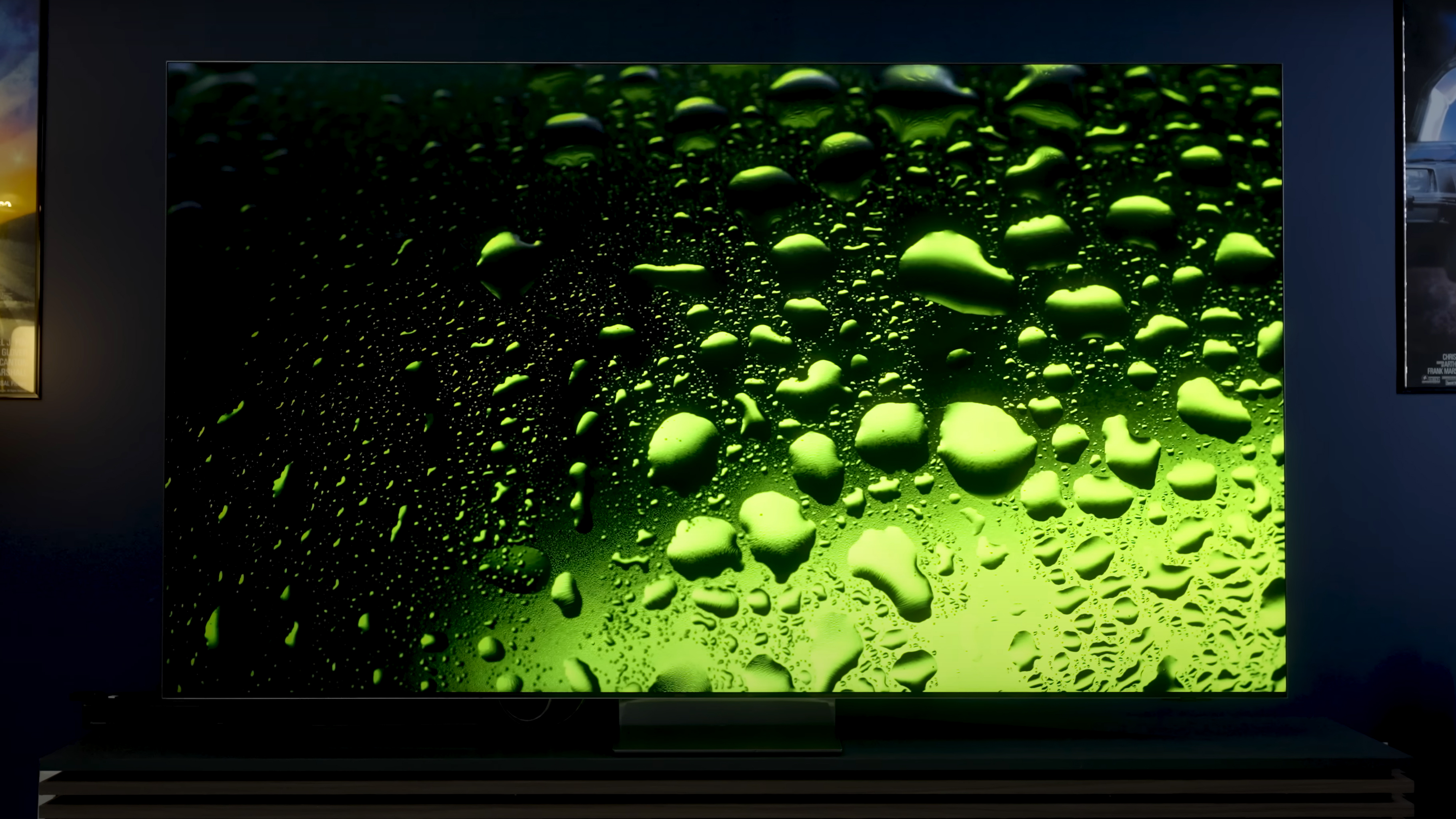 Water droplets beaded on a green background on a Samsung QN900D.