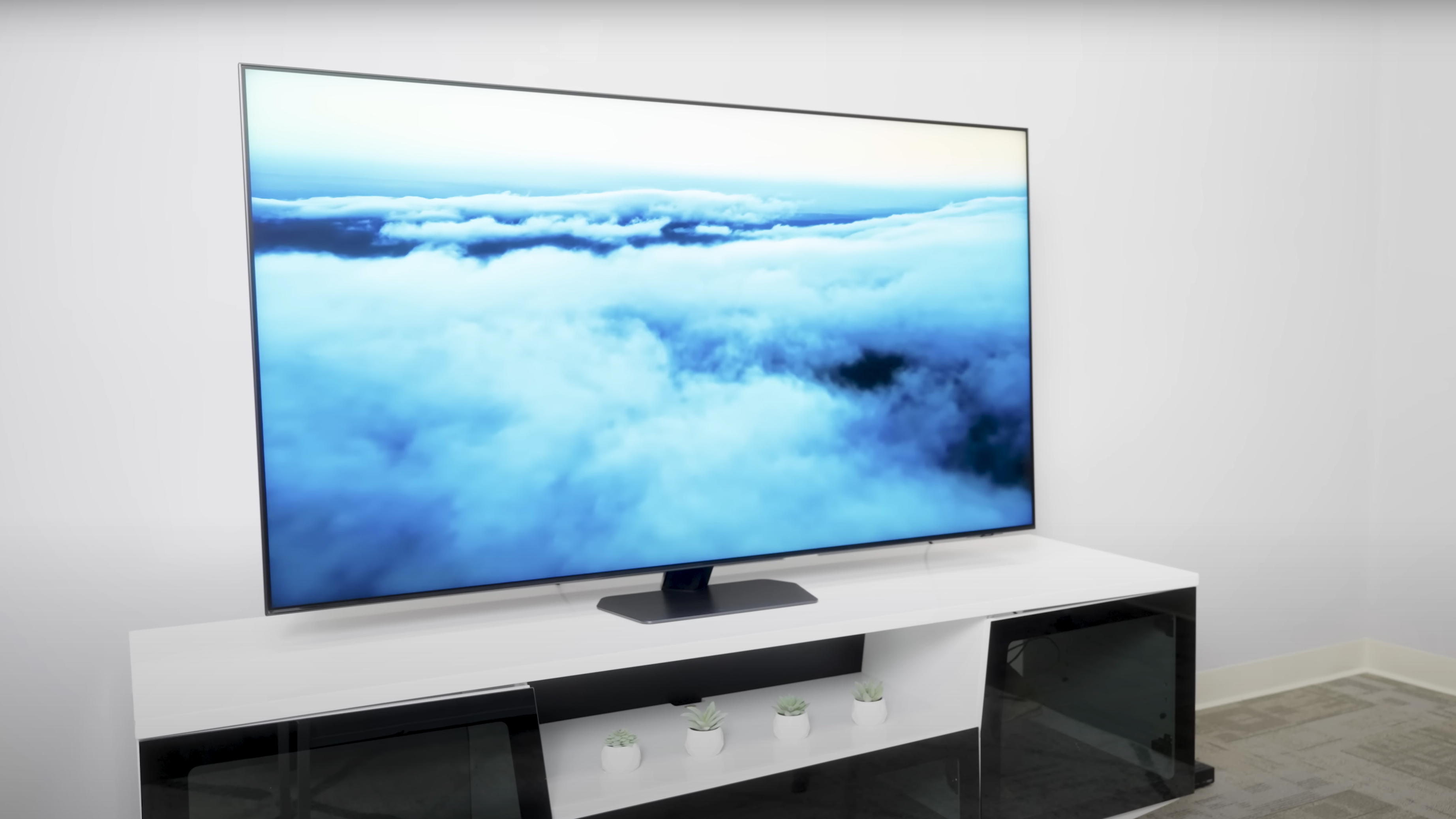 A view of a cloud-covered sky from above on a Samsung QN90D TV.