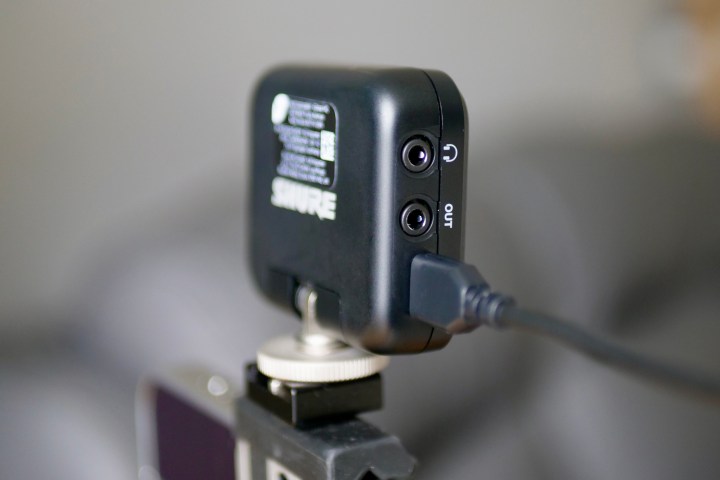 Audio connections on the side of the Shure MoveMic receiver.