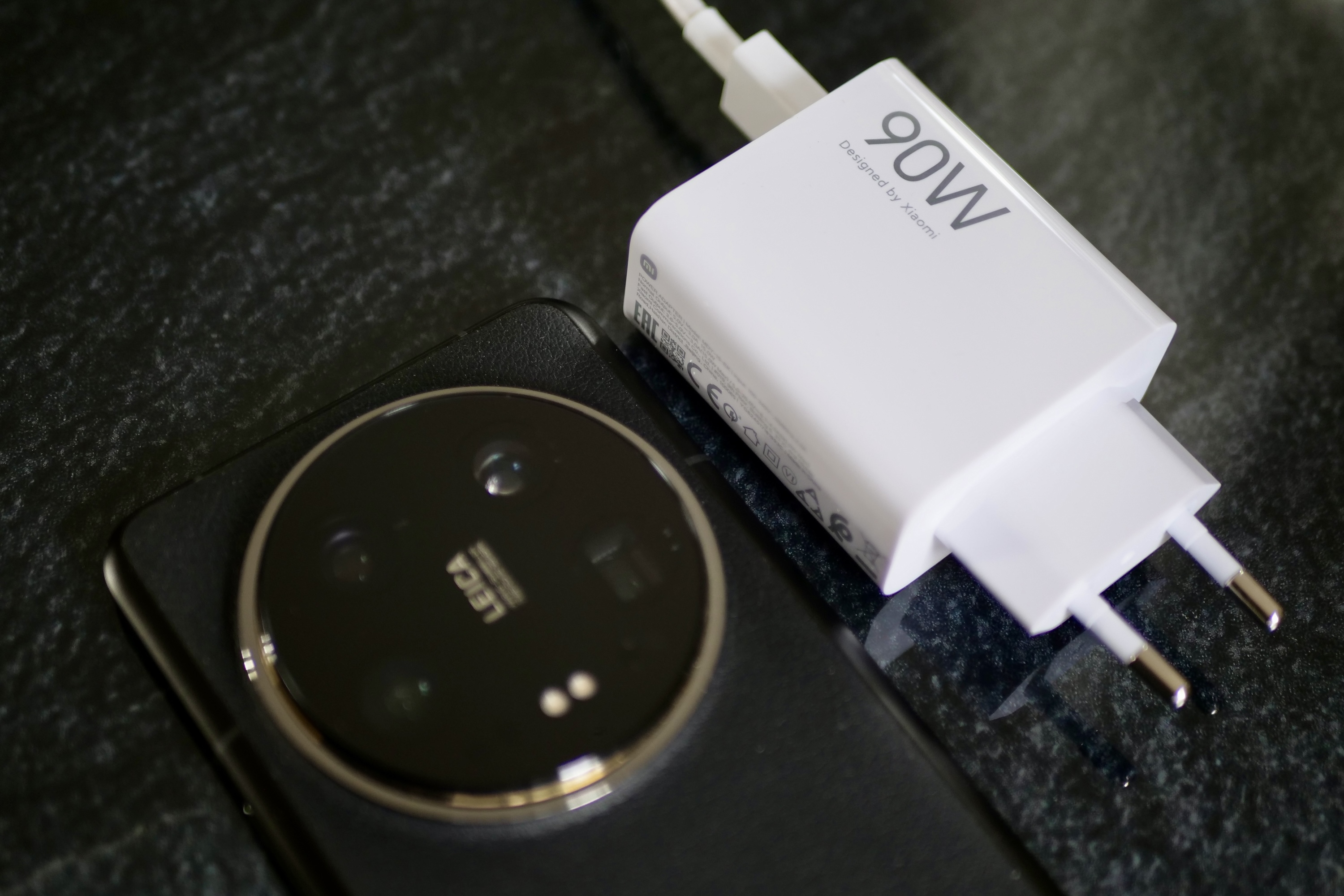 The Xiaomi 14 Ultra and a charger.
