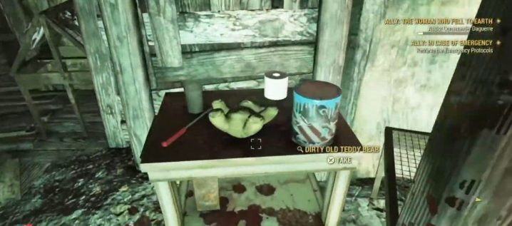 A dirty old teddy bear on a table in Fallout 76.