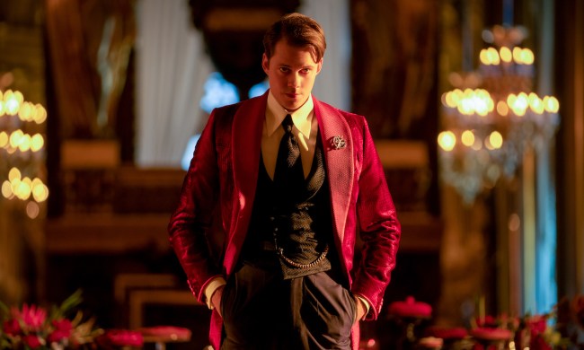 Bill Skarsgård as the Marquis de Gramont standing with his hands in his pockets in John Wick Chapter 4.