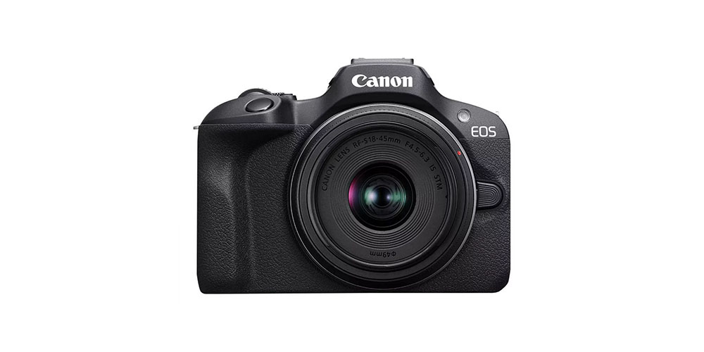 A Canon EOS R100 mirrorless camera on a white background.