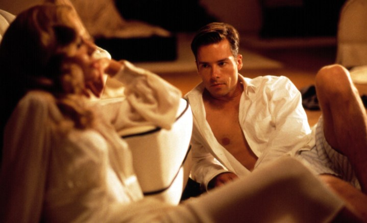 A man and a woman lie next to each other in L.A. Confidential.