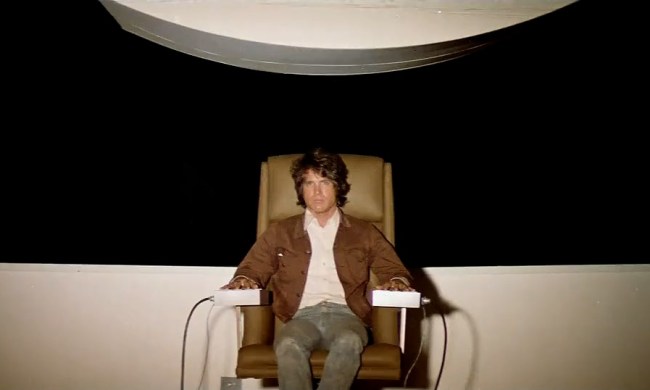Warren Beaty as Joseph Frady sitting in a chair in the movie The Parallax View