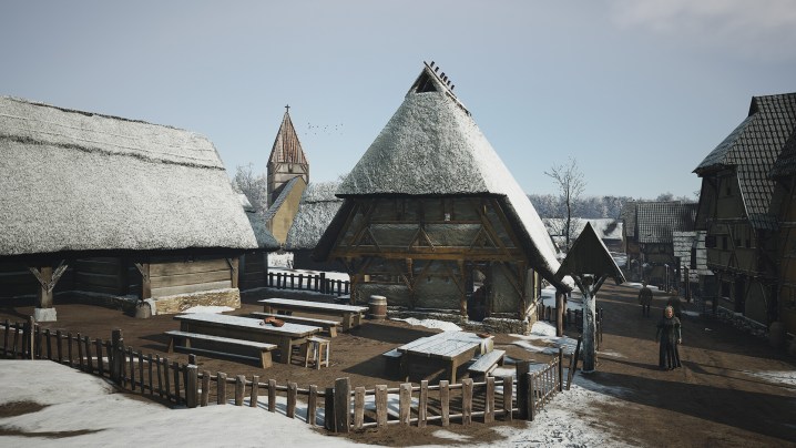 A snowy settlement in Manor Lords.