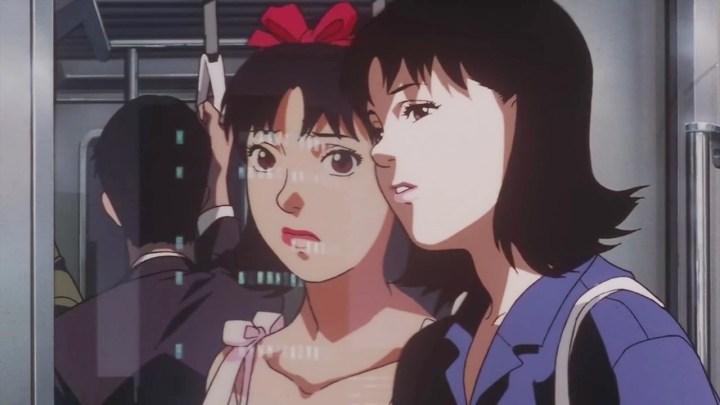 A woman leans against her own reflection in Perfect Blue.