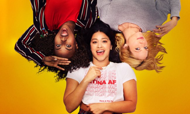 The main cast of the film Someone Great lying on a yelow background and smiling.