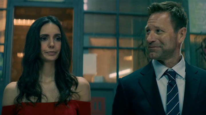 Nina Dobrev and Aaron Eckhart in The Bricklayer.