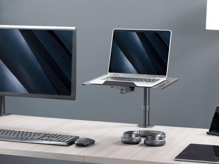 The Vivo Laptop Notebook Desk Mount Stand clamp mounted to a desk.